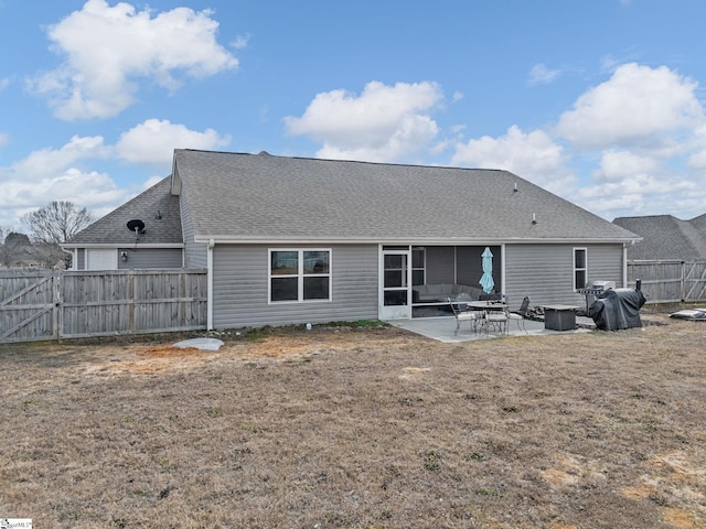 back of property featuring a yard and a patio