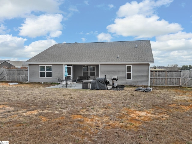 back of property with a patio