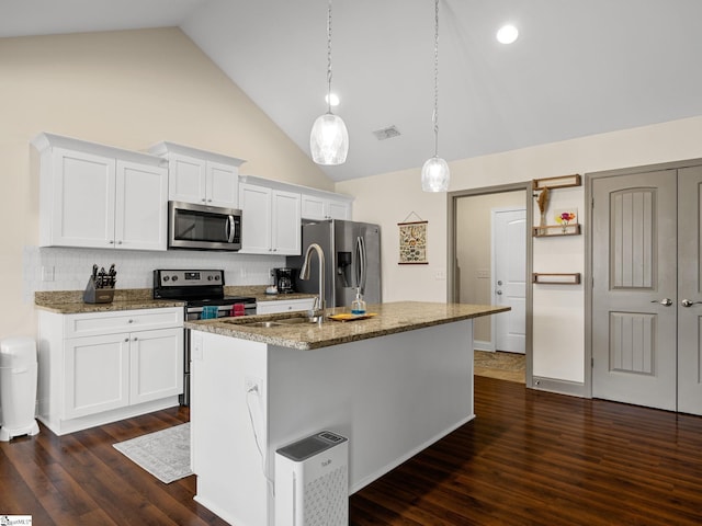 kitchen with white cabinetry, high vaulted ceiling, stainless steel appliances, and an island with sink