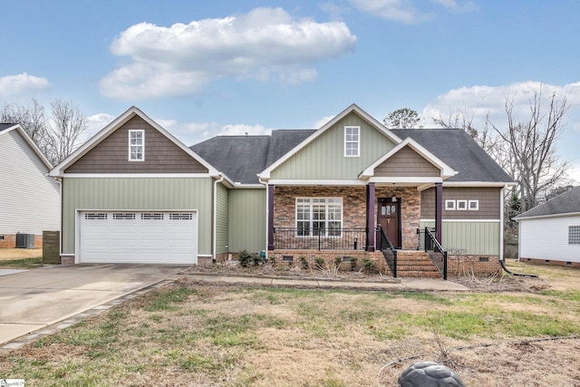 craftsman-style home with central AC unit, a garage, and a porch