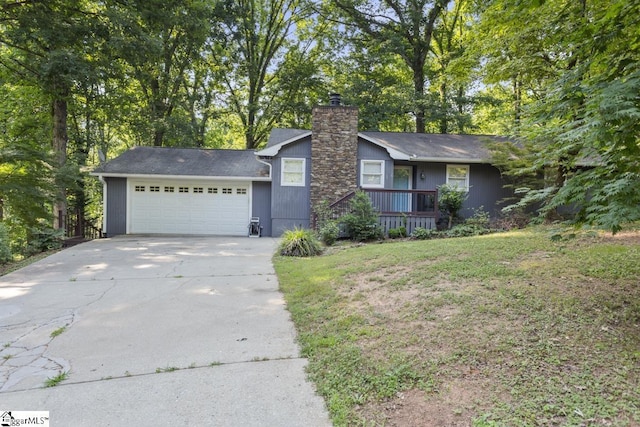 ranch-style house with a garage and a front lawn