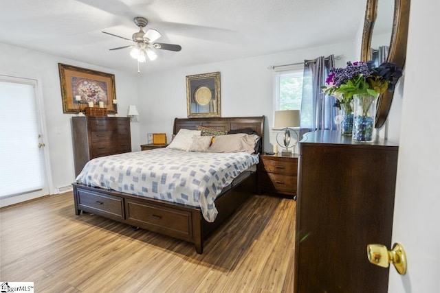 bedroom with ceiling fan and light wood-type flooring