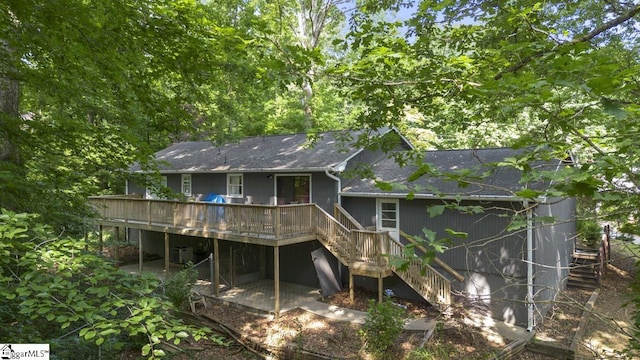 rear view of house with a wooden deck