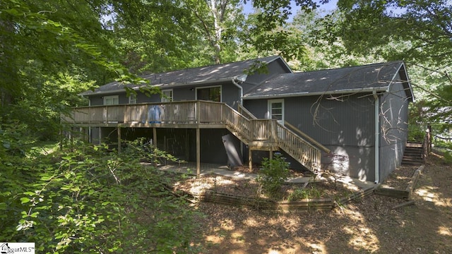 back of property featuring a deck