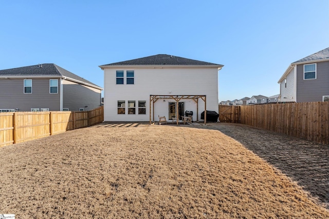 back of house with a pergola and a patio