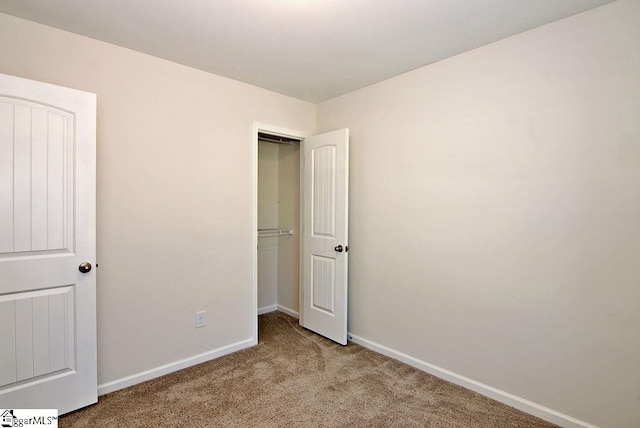 unfurnished bedroom with light carpet