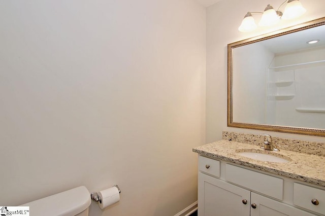 bathroom with vanity and toilet