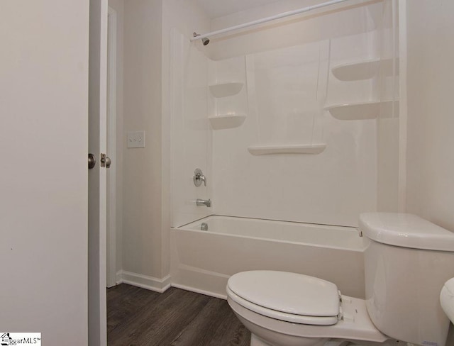 bathroom featuring wood-type flooring,  shower combination, and toilet