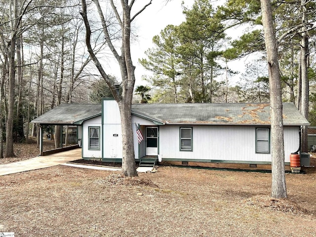 manufactured / mobile home featuring a carport and cooling unit