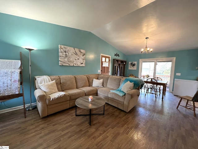 living room with lofted ceiling, a chandelier, and dark hardwood / wood-style flooring