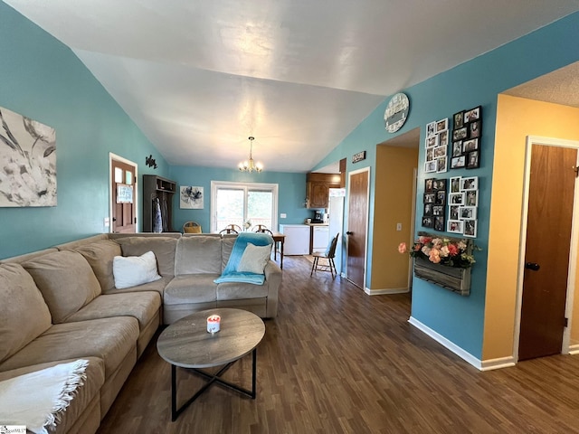 living room with hardwood / wood-style flooring, lofted ceiling, and a chandelier