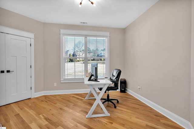 office with light hardwood / wood-style floors