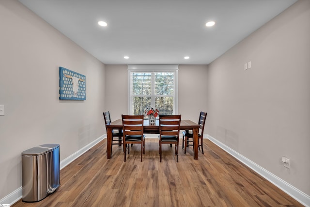 dining room with hardwood / wood-style flooring