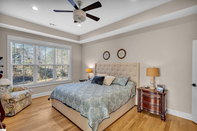 bedroom with ceiling fan and light hardwood / wood-style flooring