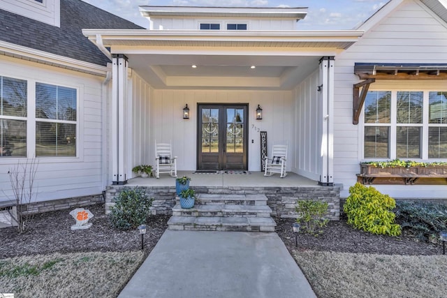 doorway to property with a porch and french doors