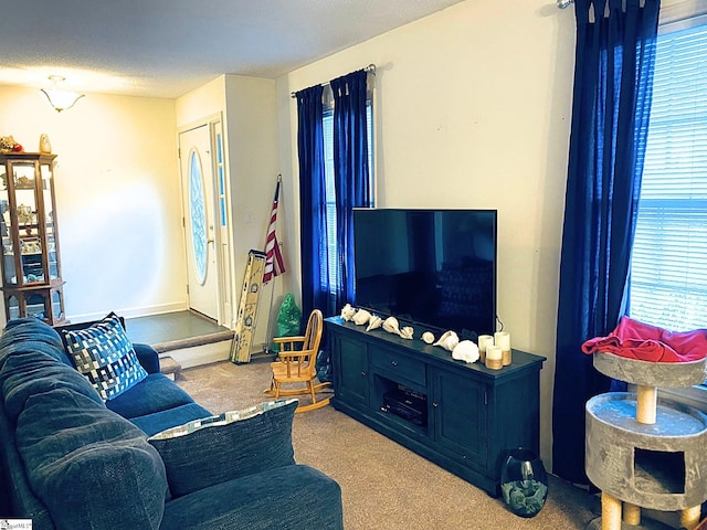 living room featuring light carpet and a textured ceiling