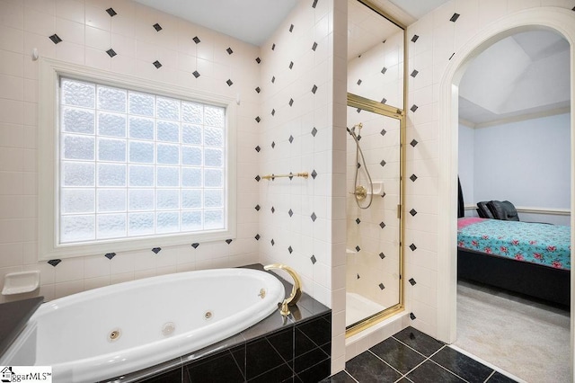 bathroom featuring separate shower and tub and tile patterned floors