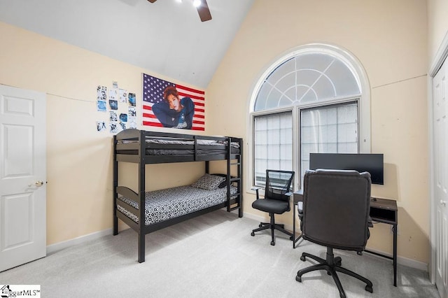 bedroom featuring multiple windows, carpet, high vaulted ceiling, and ceiling fan