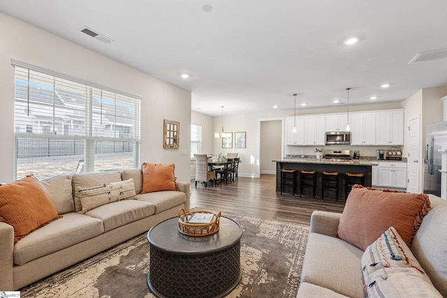 living room with dark wood-type flooring