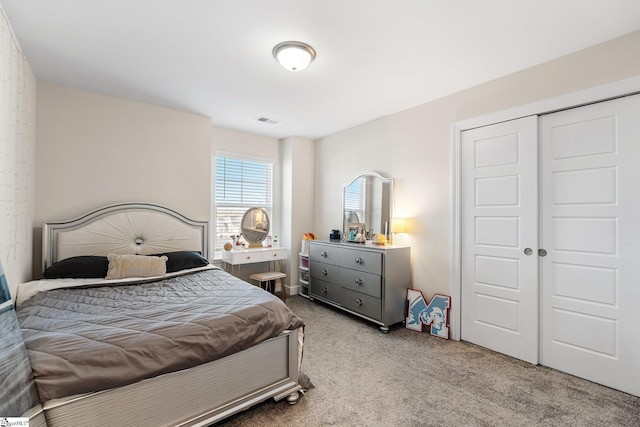 carpeted bedroom with a closet