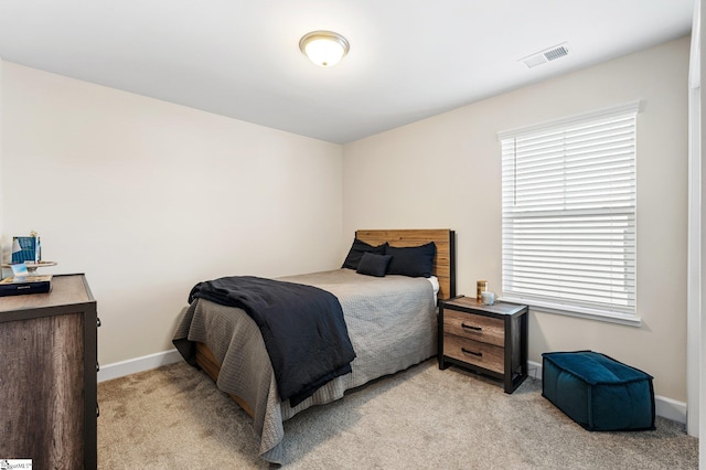 bedroom with light carpet