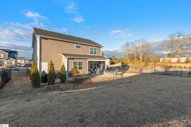 back of property featuring a yard and a patio area