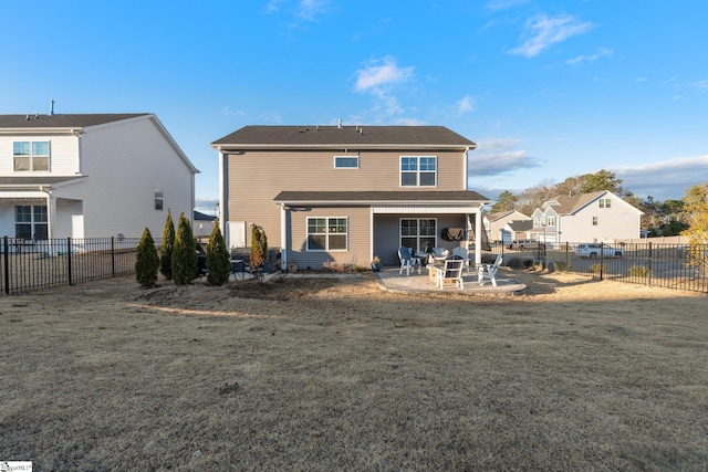 rear view of property with a lawn and a patio area