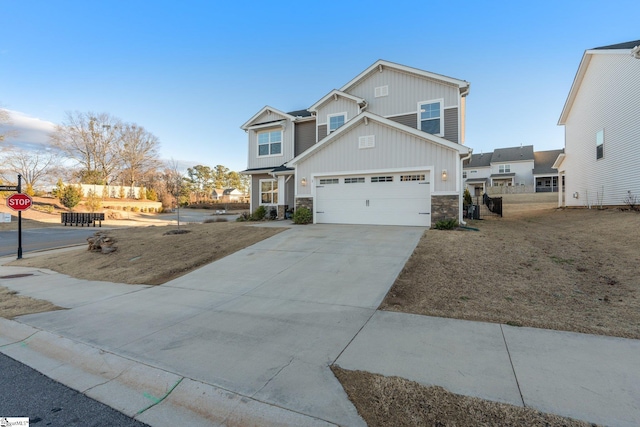 craftsman-style home with a garage and a front yard