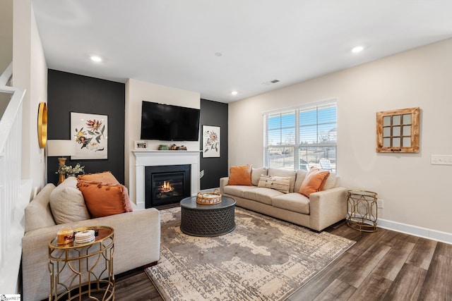 living room featuring dark wood-type flooring