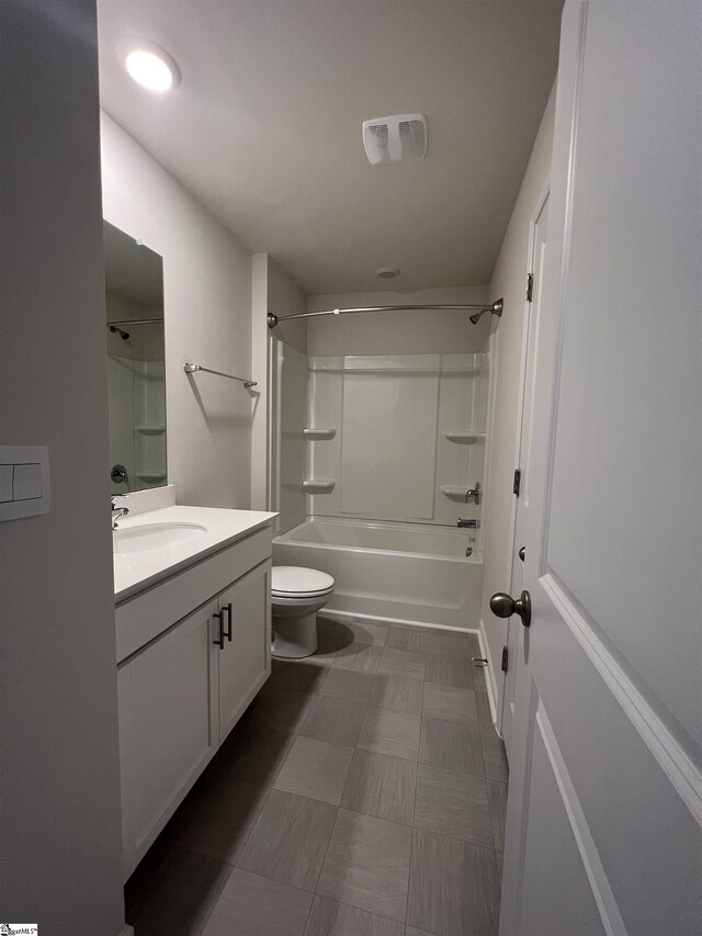 full bathroom featuring vanity, toilet, and  shower combination