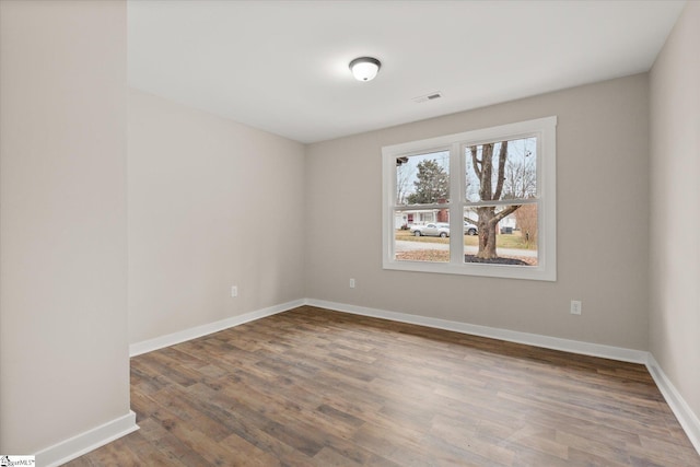 unfurnished room featuring wood-type flooring