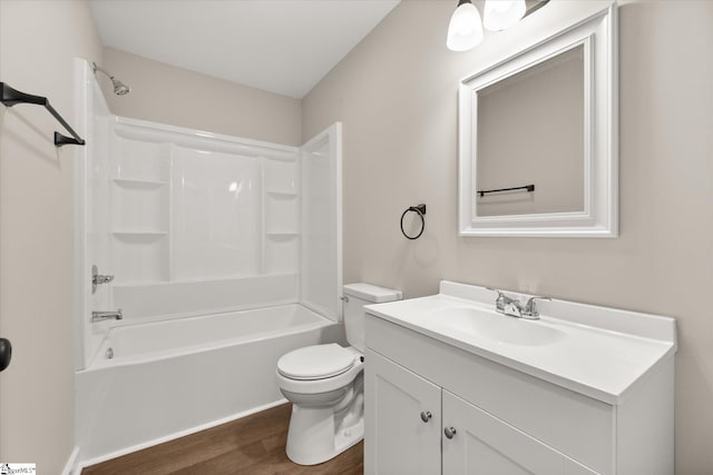 full bathroom featuring washtub / shower combination, wood-type flooring, toilet, and vanity