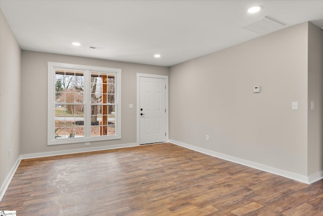 spare room with hardwood / wood-style flooring