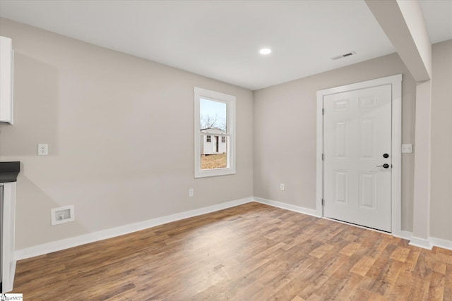 entryway with hardwood / wood-style flooring