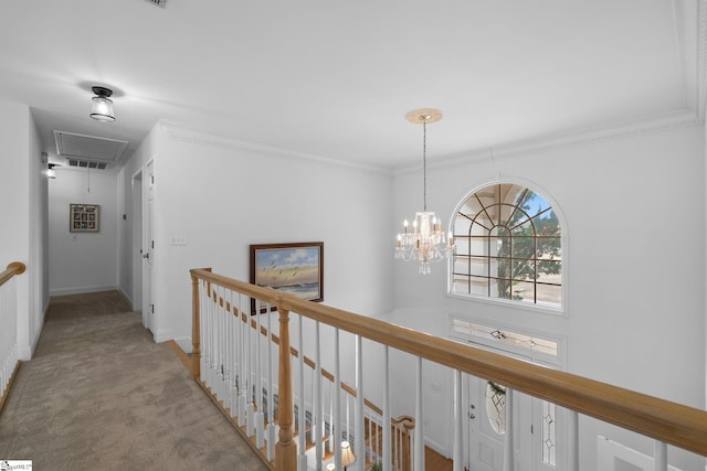 corridor with light carpet, a notable chandelier, and crown molding