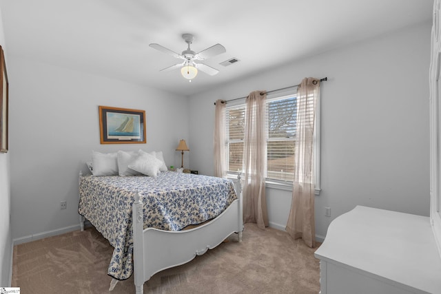 bedroom featuring light carpet and ceiling fan