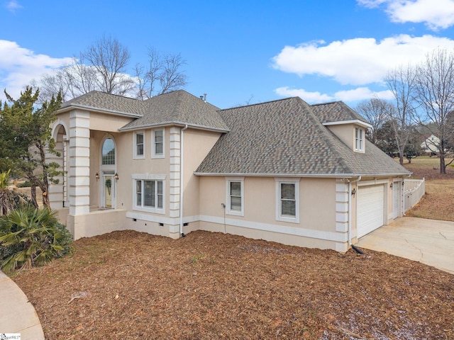 view of side of property featuring a garage