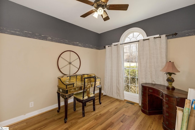 sitting room with light hardwood / wood-style flooring and ceiling fan