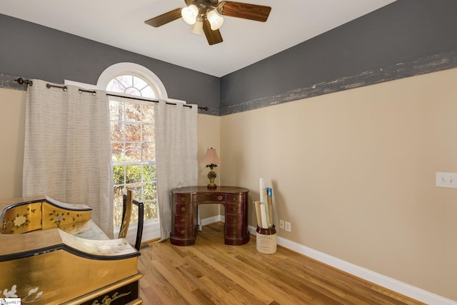 sitting room with light hardwood / wood-style flooring, a wealth of natural light, and ceiling fan