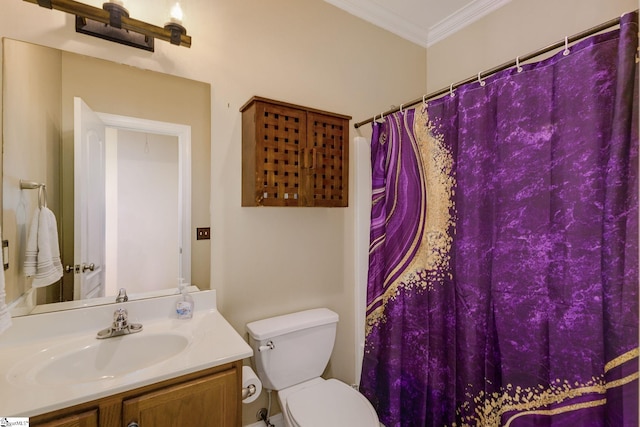 bathroom with crown molding, vanity, and toilet