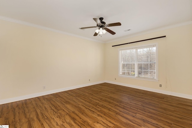 empty room featuring hardwood / wood-style floors, crown molding, and ceiling fan