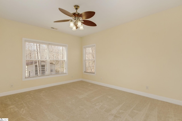 carpeted empty room with ceiling fan