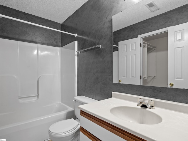 full bathroom with vanity, shower / bathtub combination, toilet, and a textured ceiling