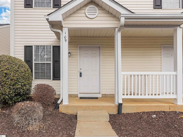 doorway to property with a porch