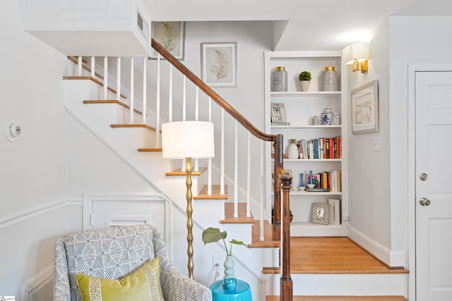 stairs with wood-type flooring