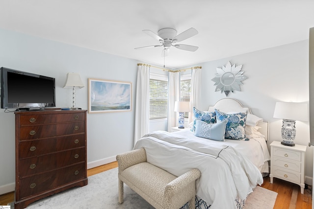 bedroom featuring ceiling fan and light hardwood / wood-style flooring