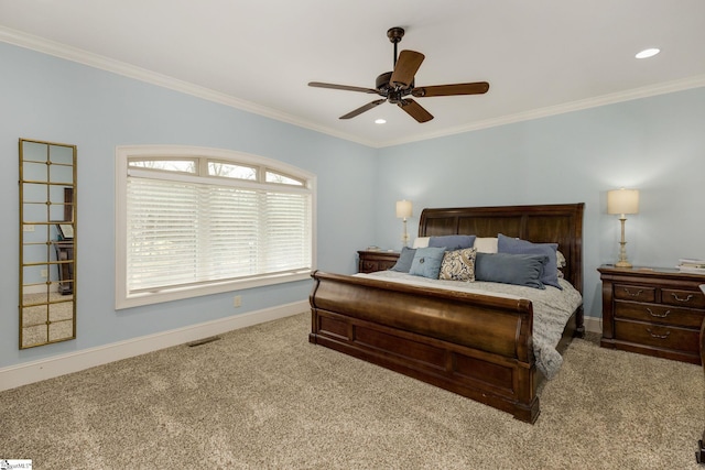 bedroom featuring crown molding, light colored carpet, and ceiling fan