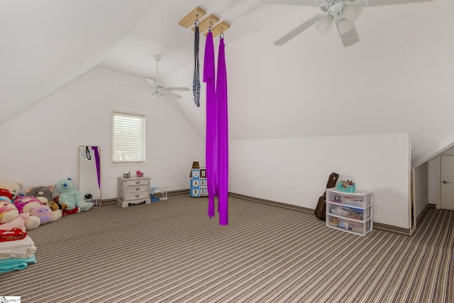 recreation room featuring vaulted ceiling, carpet, and ceiling fan