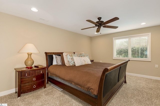 bedroom with light carpet and ceiling fan