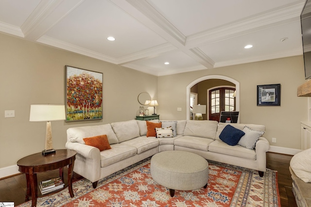 living room featuring coffered ceiling, hardwood / wood-style flooring, ornamental molding, and beamed ceiling